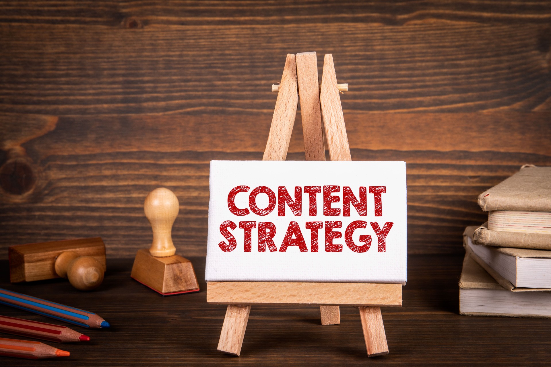 Content Strategy concept. Miniature easel on office desk